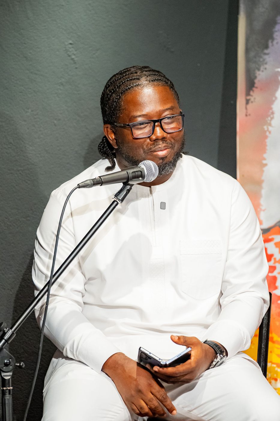 At the microphone