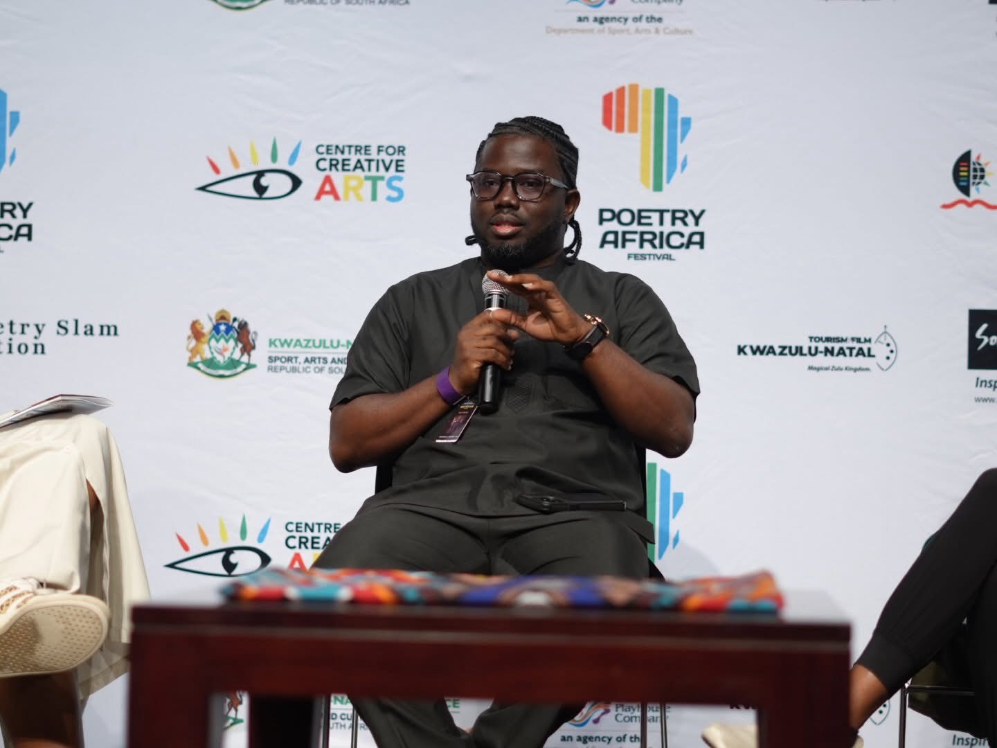 Theophilus Atuahene Adu speaking on the Branding: Creating a Professional Artistic Identity panel at Poetry Africa 2026
